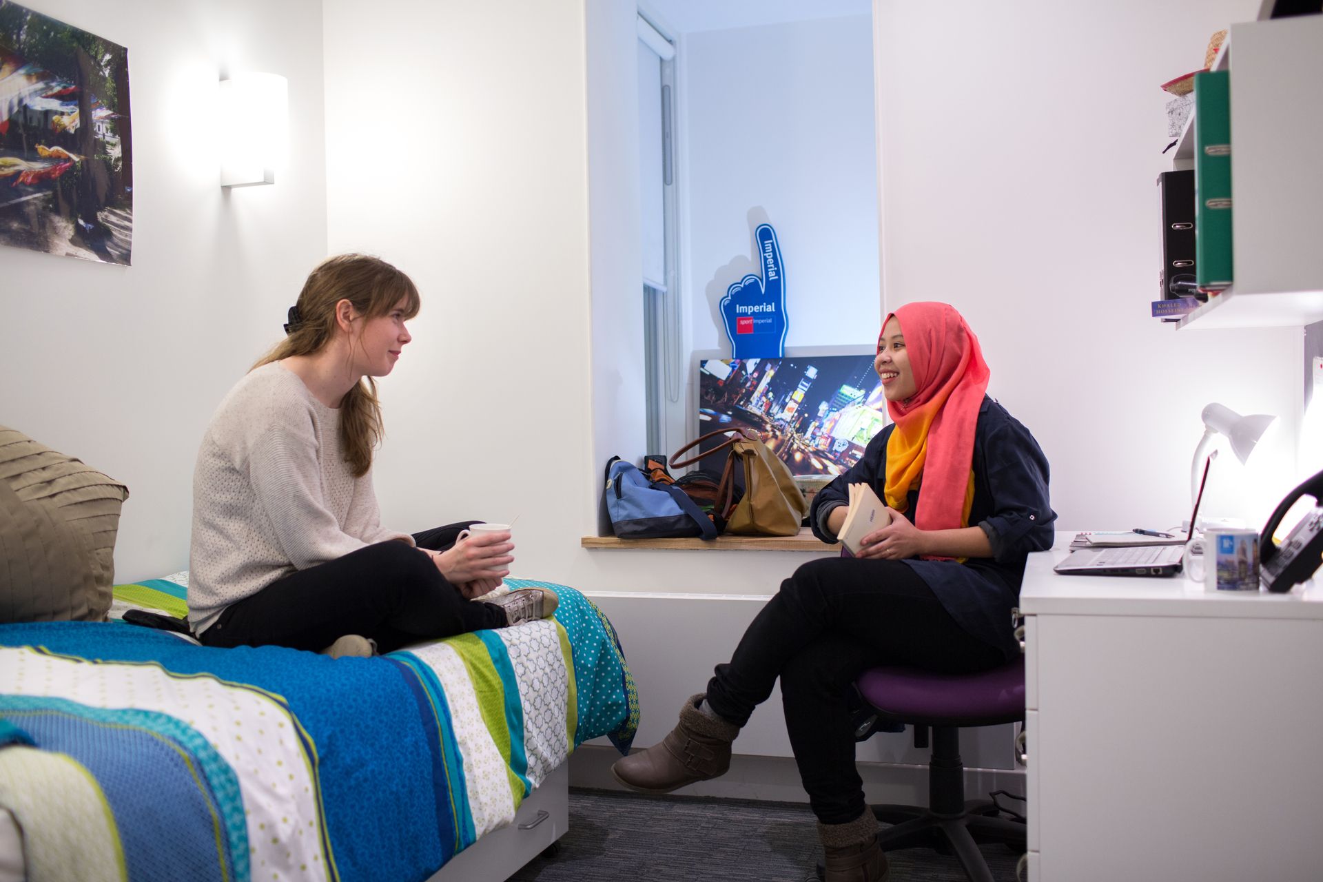 Students chatting in a student bedroom
