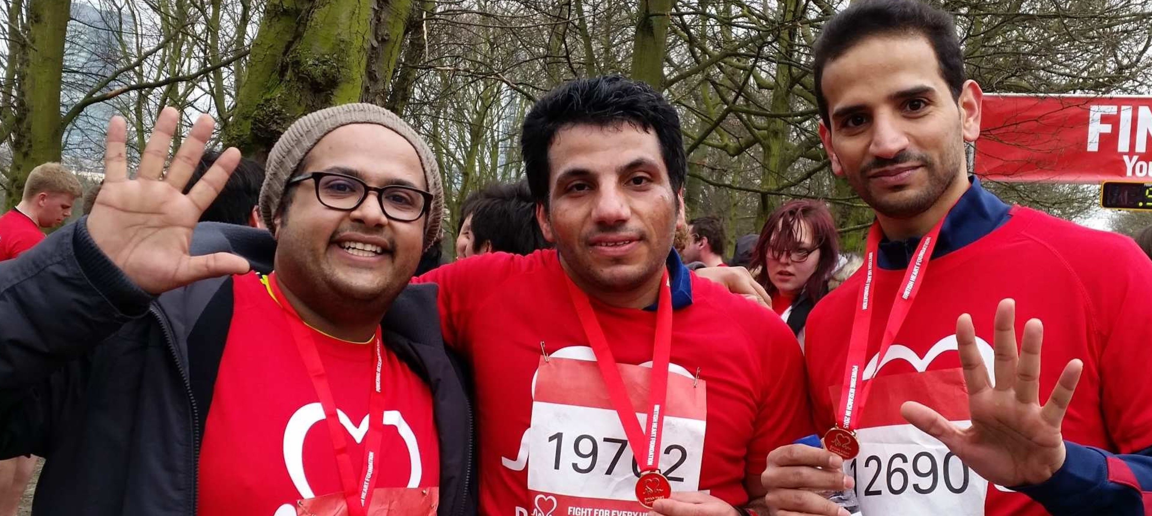 Three students from Imperial's Saudi society at the finish line of a run for charity